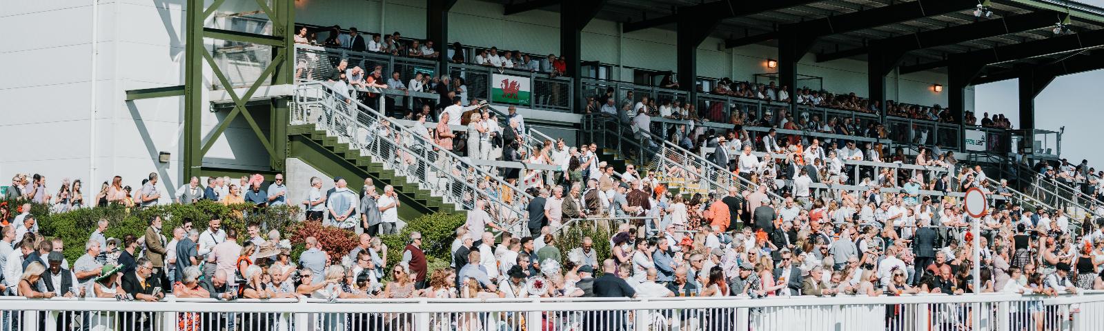 A full grandstand at Ffos Las Racecourse