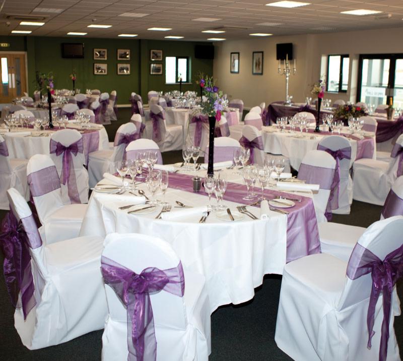 Tables set for a wedding reception at ffos Las racecourse